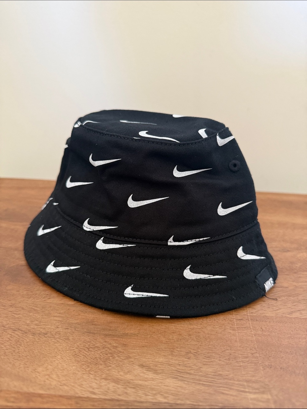 Nike Kids Black Bucket Hat with White Swoosh Print